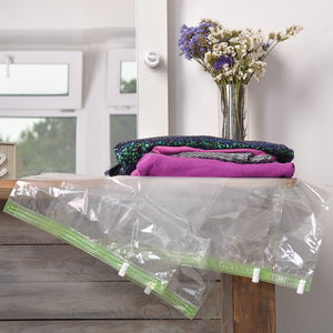 The Chestnut 8 Space Saver Vacuum or Pump Needed-Storage Clothes-Reusable Packing Sacks-Travel Accessories Luggage Compression Bags, Transparent and Green With a White Clip